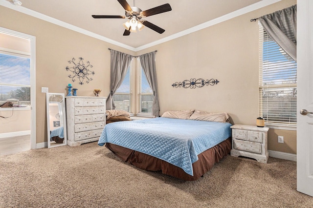 carpeted bedroom featuring multiple windows, crown molding, and ceiling fan