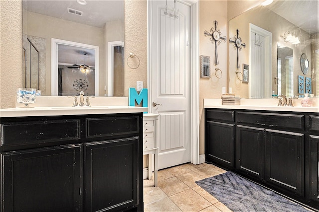 bathroom featuring vanity, tile patterned floors, and ceiling fan