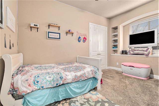 carpeted bedroom featuring a closet