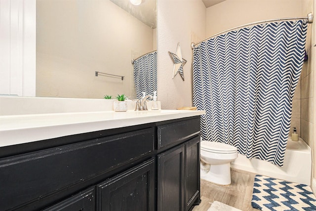 full bathroom featuring vanity, toilet, and shower / tub combo