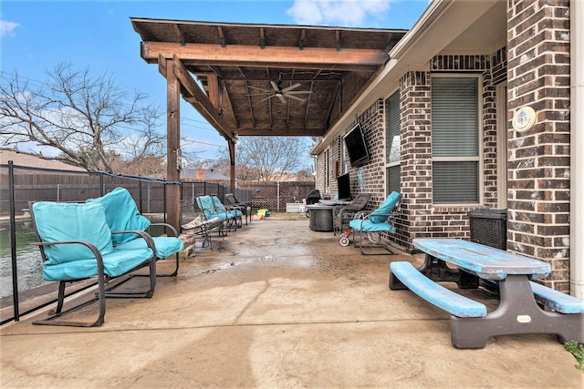 view of patio featuring ceiling fan