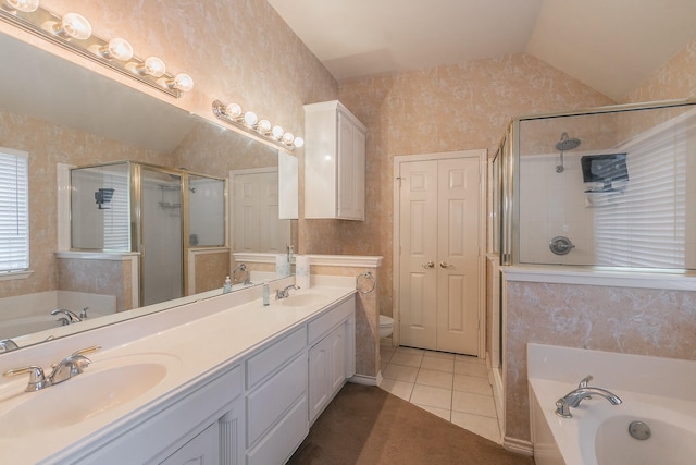 full bathroom featuring a garden tub, a sink, and wallpapered walls