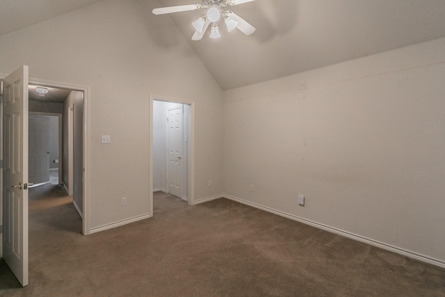 unfurnished bedroom featuring ceiling fan, dark colored carpet, high vaulted ceiling, and baseboards