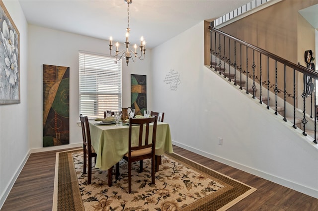 dining space featuring dark hardwood / wood-style floors and a notable chandelier