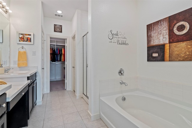 bathroom featuring vanity, tile patterned flooring, and independent shower and bath