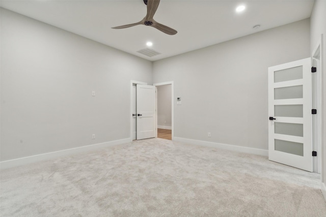 unfurnished bedroom featuring ceiling fan and light carpet