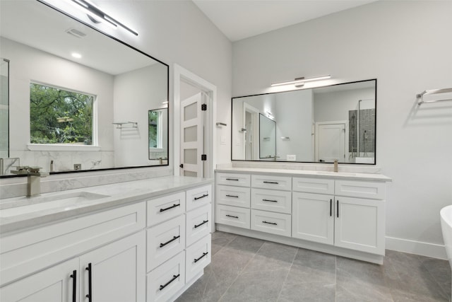 bathroom with vanity and tile patterned floors