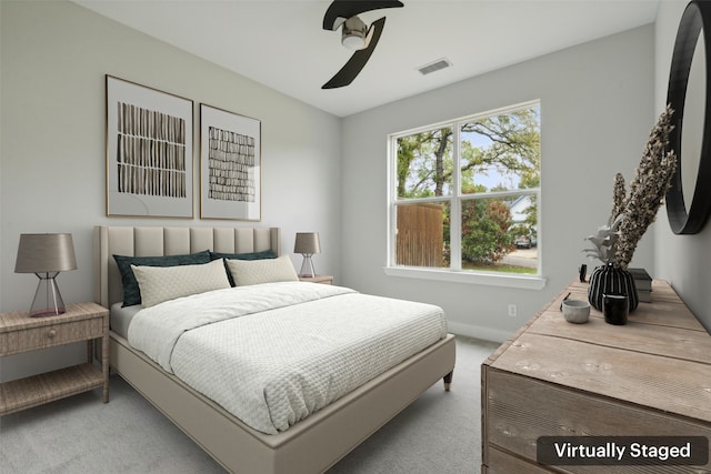 carpeted bedroom with ceiling fan