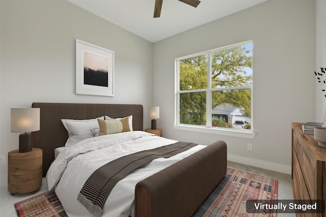 carpeted bedroom with ceiling fan