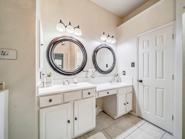 bathroom featuring tile patterned flooring and vanity