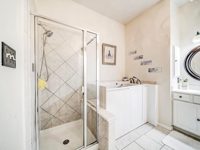 bathroom featuring vanity, shower with separate bathtub, and tile patterned flooring