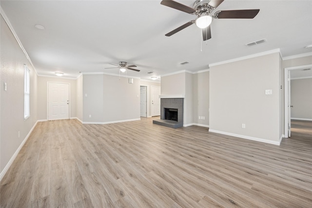unfurnished living room with light wood-style flooring, ceiling fan, visible vents, and crown molding