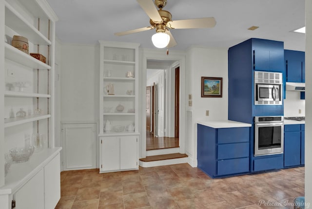 kitchen with stainless steel appliances, blue cabinetry, and ceiling fan