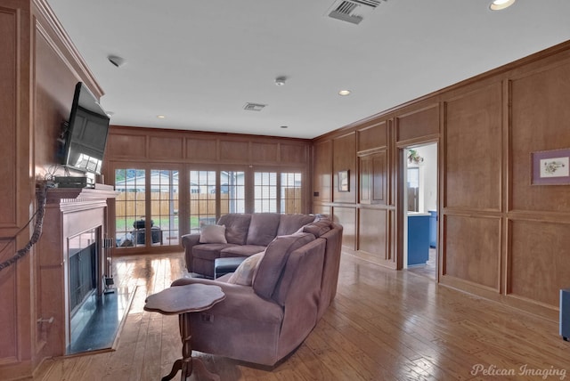 living room with light hardwood / wood-style flooring