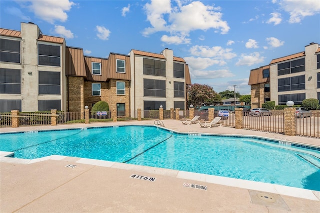 view of swimming pool featuring a patio area