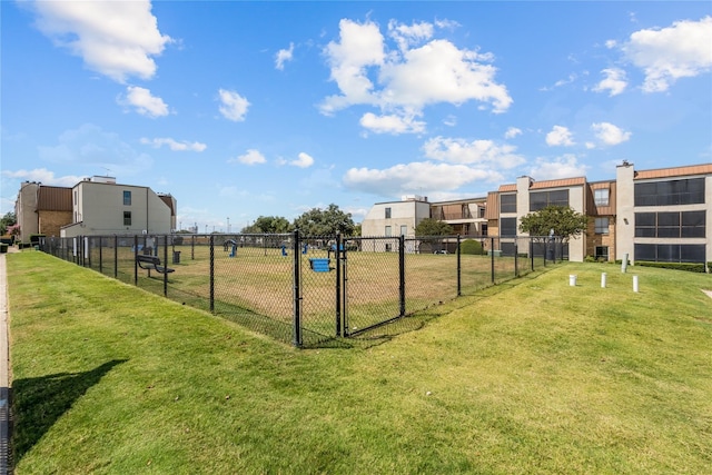 view of property's community featuring a yard