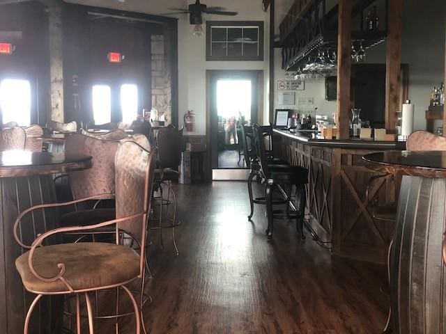1434 Lakeside Trl, Whitney, TX 76692 - bar featuring dark wood-type flooring and ceiling fan