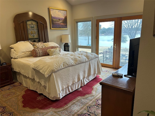 1434 Lakeside Trl, Whitney, TX 76692 - bedroom with multiple windows, access to exterior, and lofted ceiling