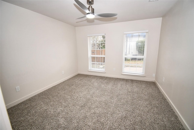 spare room featuring ceiling fan and carpet floors