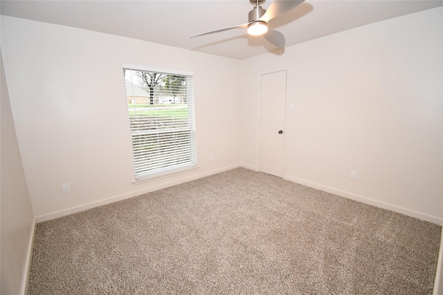 unfurnished room with carpet and ceiling fan