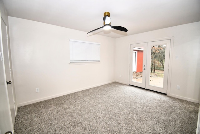 carpeted empty room with french doors and ceiling fan