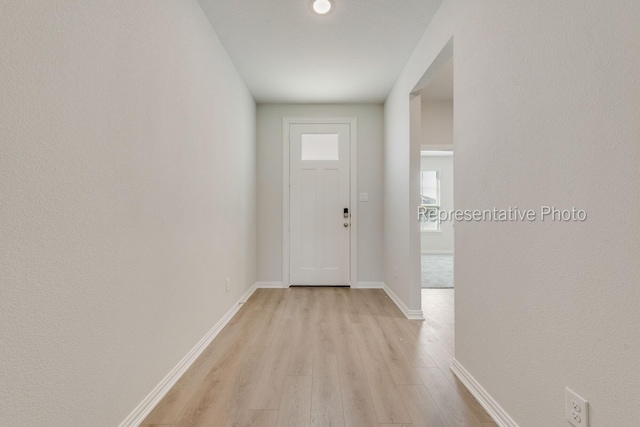 entryway with light hardwood / wood-style flooring