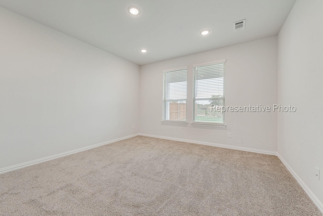 spare room with carpet flooring