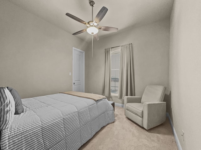 bedroom featuring light carpet and ceiling fan