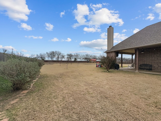 view of yard with a patio and a rural view