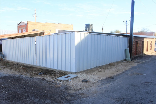 view of side of property featuring central AC unit