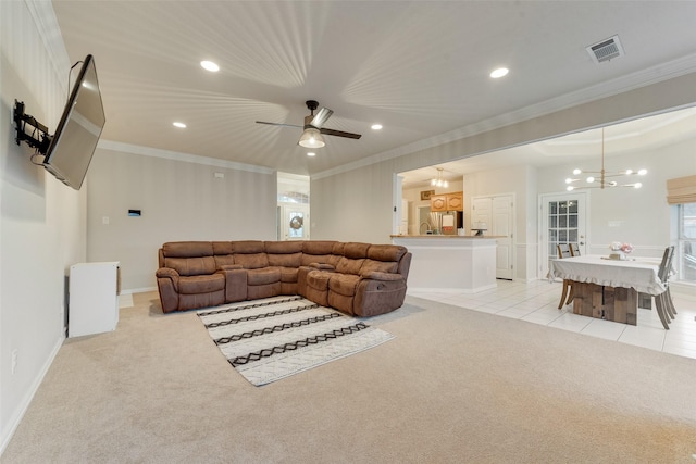 living room featuring crown molding, light colored carpet, and ceiling fan with notable chandelier