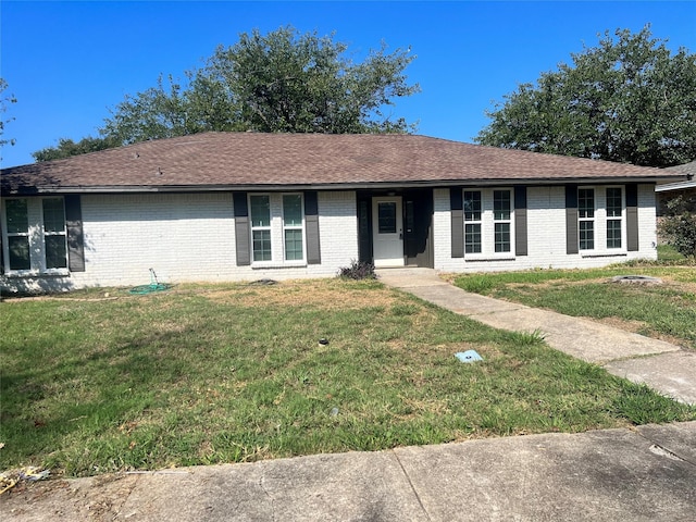 single story home featuring a front yard