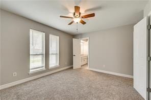 unfurnished bedroom with light colored carpet