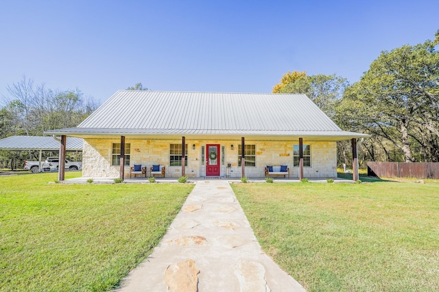 farmhouse-style home featuring a porch and a front yard