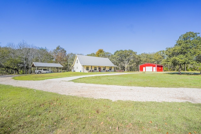 exterior space with an outbuilding and a garage