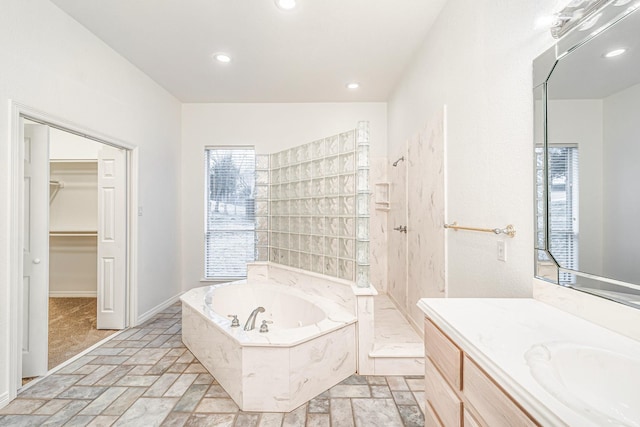 4781 Joe Wilson Rd, Midlothian, TX 76065 - full bath featuring healthy amount of natural light, walk in shower, a bath, vanity, and recessed lighting