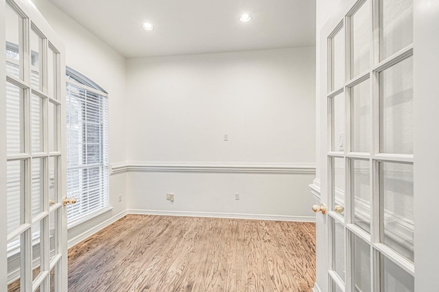 4781 Joe Wilson Rd, Midlothian, TX 76065 - empty room featuring wood finished floors, baseboards, recessed lighting, and french doors