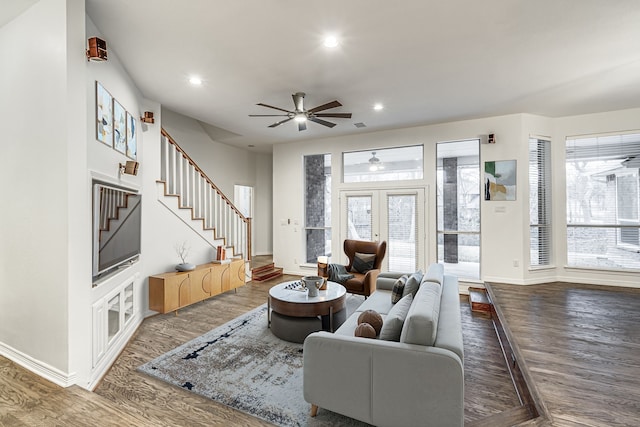 living room with stairs, baseboards, wood finished floors, and recessed lighting