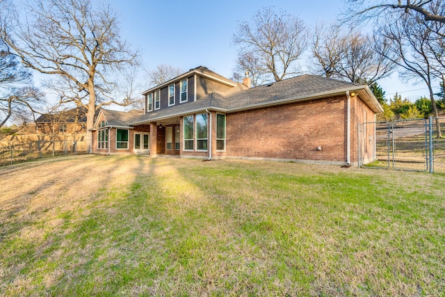 4781 Joe Wilson Rd, Midlothian, TX 76065 - back of house with a gate, brick siding, a chimney, and roof with shingles