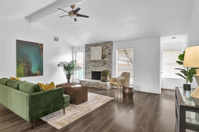 living room featuring ceiling fan, dark hardwood / wood-style floors, vaulted ceiling with beams, and a fireplace