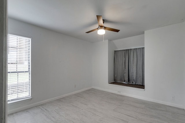 spare room featuring ceiling fan