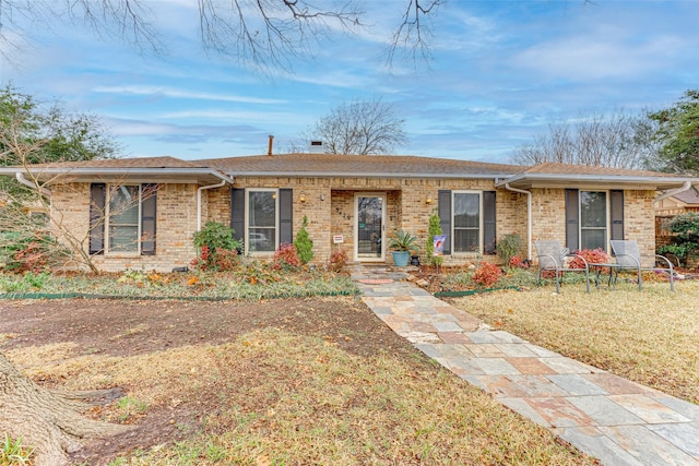 ranch-style house with a front lawn