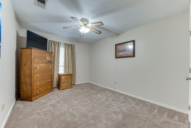 unfurnished bedroom featuring light carpet and ceiling fan