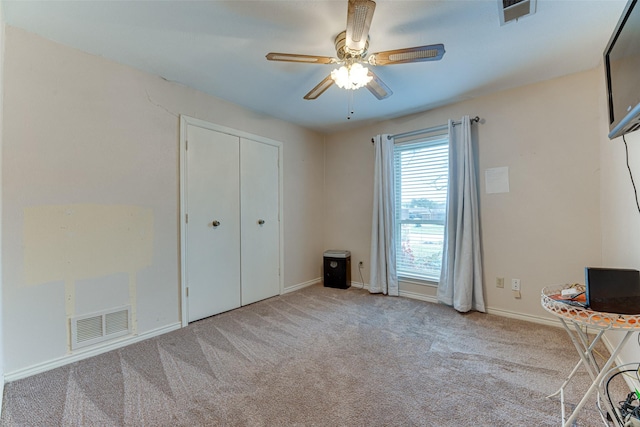 unfurnished bedroom with light carpet and ceiling fan