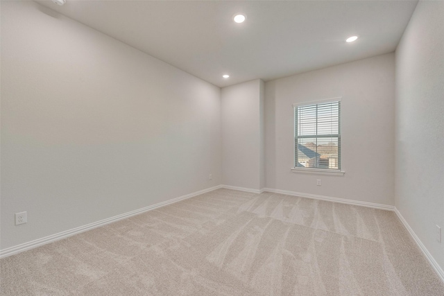 empty room featuring light colored carpet