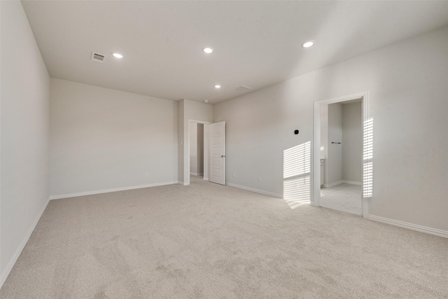 spare room with light colored carpet