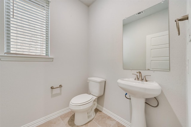 bathroom with sink, tile patterned floors, and toilet