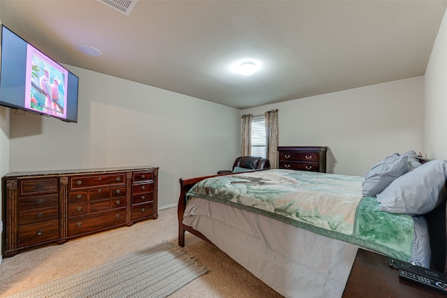 bedroom featuring light colored carpet