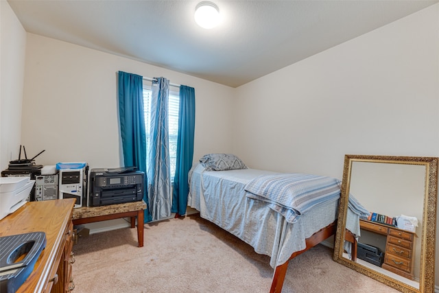 bedroom with light colored carpet