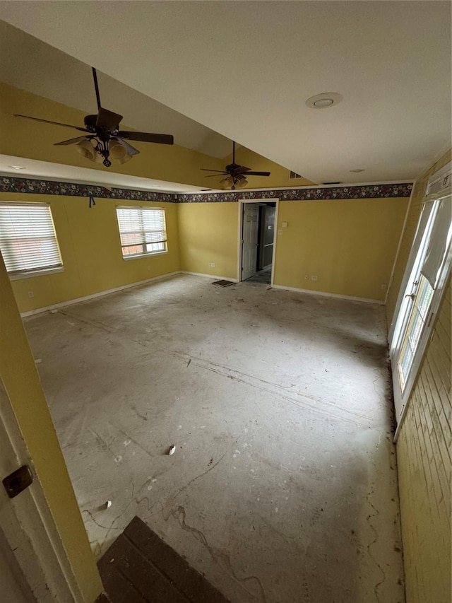 spare room with lofted ceiling